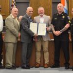 Schenectady County Sheriff Dagostino receives a proclamation from Schenectady County Legislator Tom Constantine