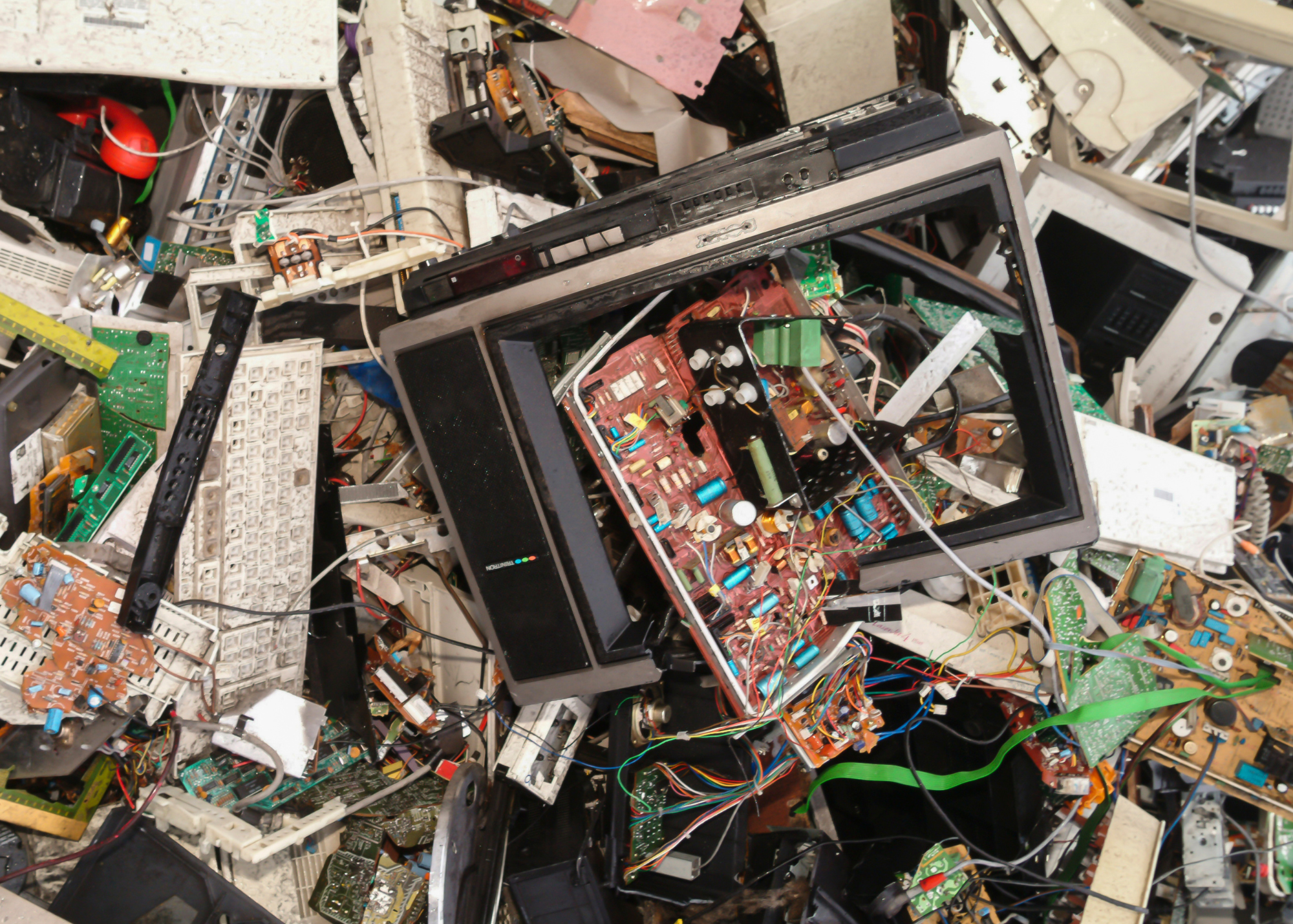 photos of old mother boards, wires, and discarded electronics