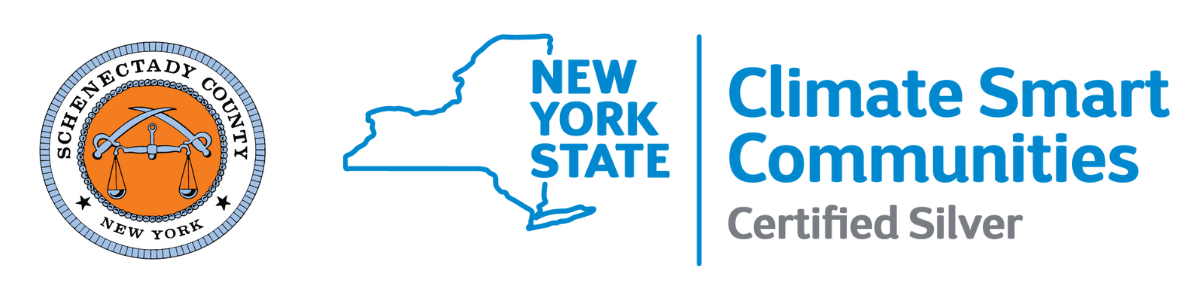 outline of New York State with the text Climate Smart Communities Certified Silver and Schenectady County Seal